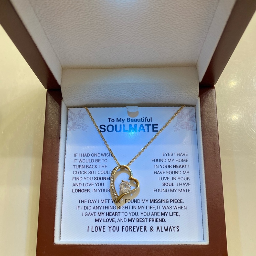 Never worn , gold Qbert zirconium heart necklace